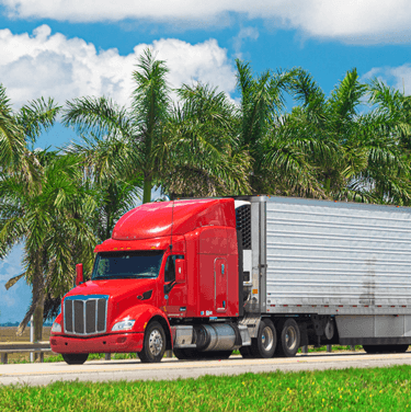 Freight Shipping from Mssouri to Florida Red Semi Truck on Highway in Florida