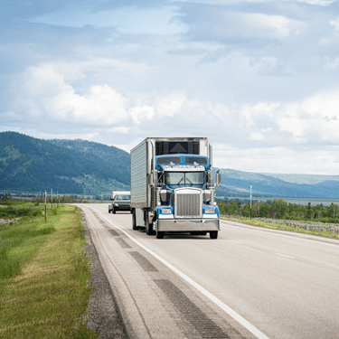 Freight Shipping from New York to California - Blue truck on road