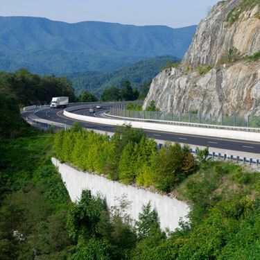 Freight Shipping from Tennessee to Florida - Truck on highway by mountains