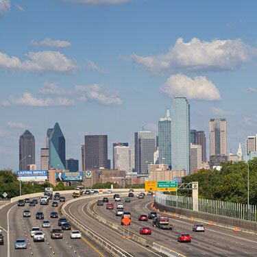 Texas city skyline during day with white clouds in sky