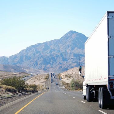 freight shipping from Kansas to California - truck on rural California highway
