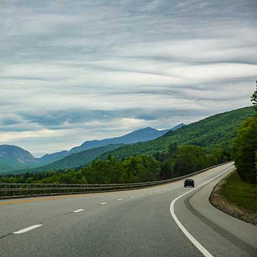 Shipping Freight from Vermont to Florida - Scenic road with clouds