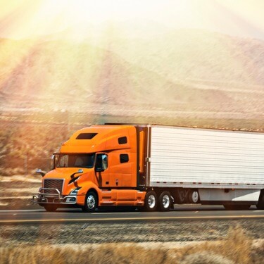 Freight Shipping from Washington D.C. - Orange Semi Truck in the Sunshine