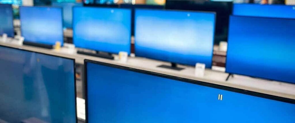 Computer monitors side by side on a table